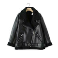 Black leather jacket with fur lining on a hanger against a white background