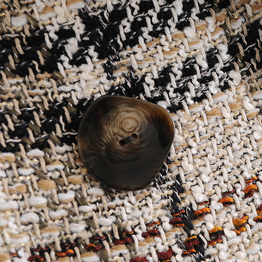 Close-up of a textured fabric with buttons