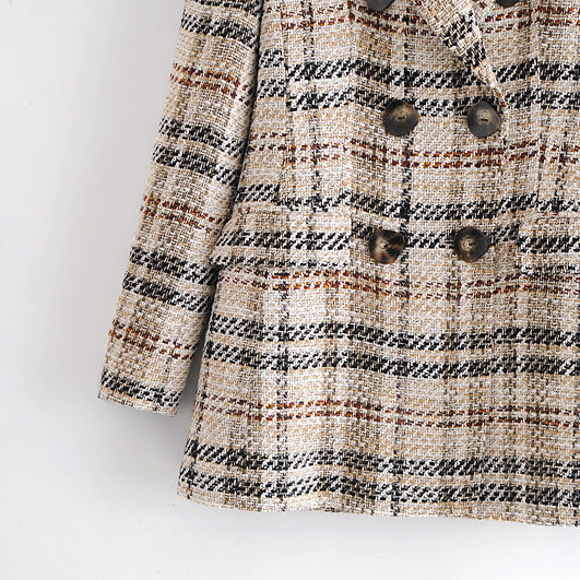 Plaid patterned coat on a white background