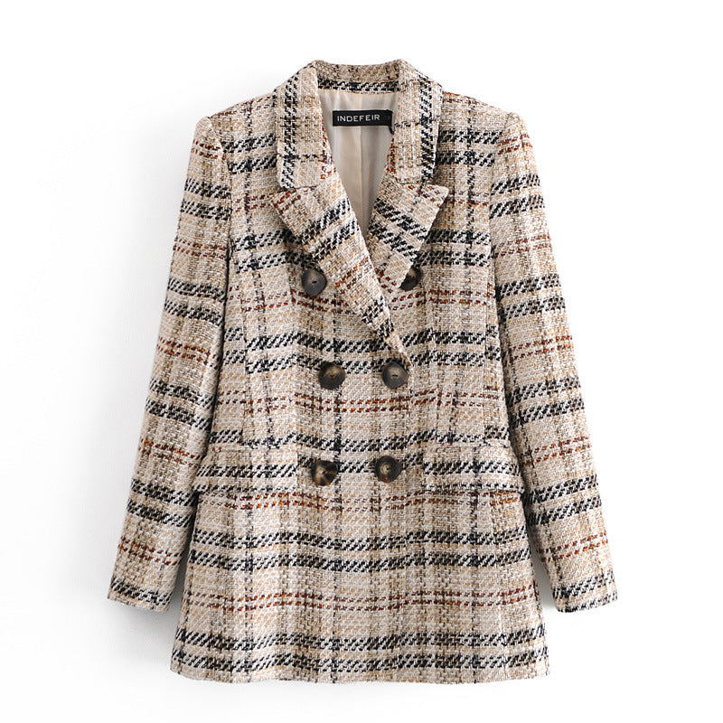 Plaid patterned coat on a white background