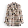 Plaid patterned coat on a white background