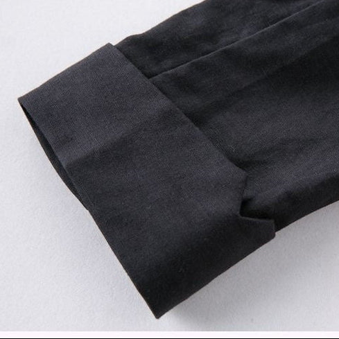 Three close-up detail shots of a black fabric garment, showing a buttoned lapel, a pocket seam, and a folded cuff on a light background.